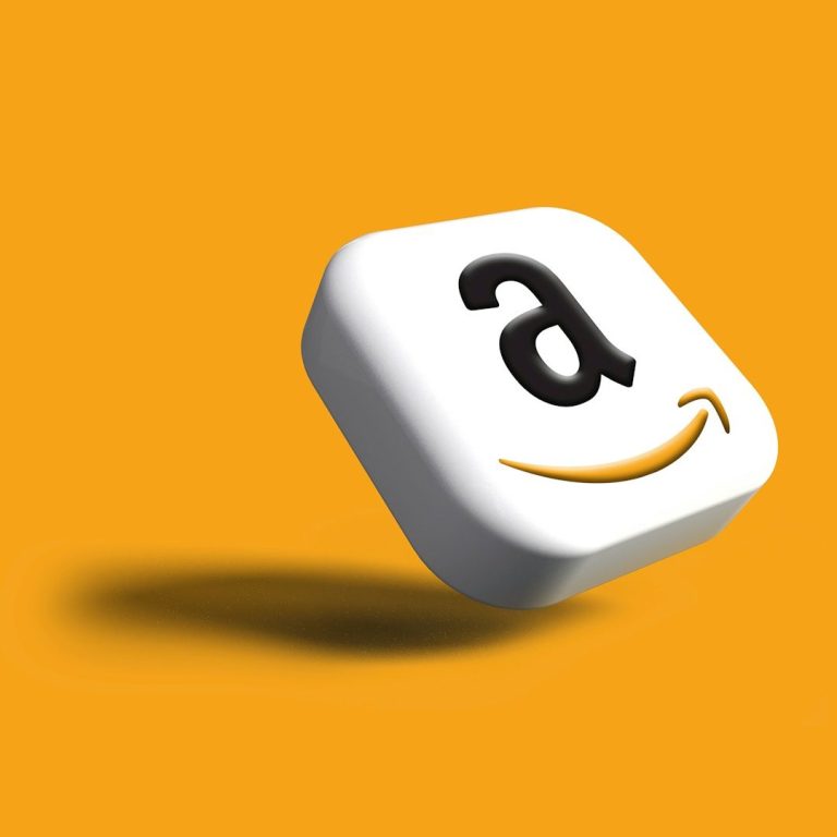 Amazon Logo Amazon logo on a stylish white keycap against an orange background.